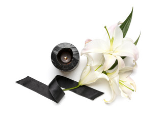 Composition with beautiful lily flowers, black funeral ribbon and burning candle on white background