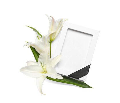 Blank funeral frame and beautiful lily flowers on white background