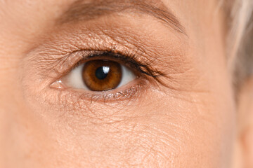 Mature woman with brown eyes, closeup