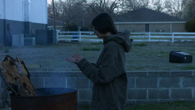 Young Woman Tends To Trashcan Fire In Rural America Countryside BMPC4K