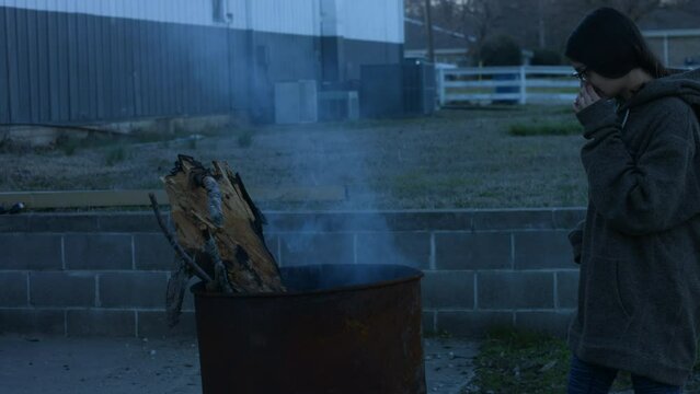 Young Woman Tends To Trashcan Fire In Rural America Countryside BMPC4K