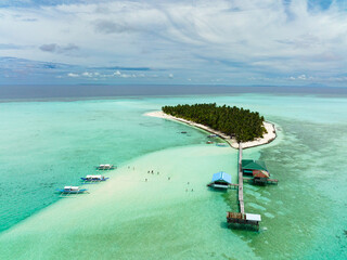 Aerial view of tropical island on an atoll with a beautiful beach. Onok Island, Balabac,...