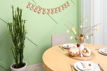 Interior of dining room with table served for Easter celebration