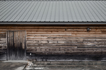 Dreary weathered and dirty wood barn building