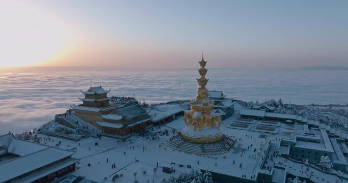sunrise at Emei mountain summit at winter day with sea of clouds
