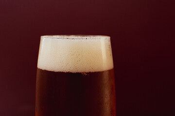 Detail of beer head on a glass, close-up photo, space for text