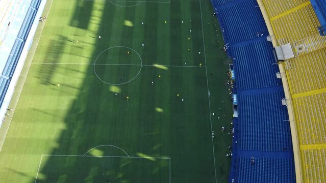 Aerial birds eye shot of professional soccer player during session in Bombonera Stadium of Boca Juniors