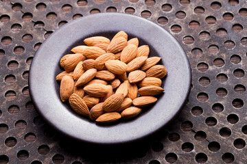 pile of natural almonds (Prunus dulcis) close-up image