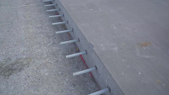 Massive modern concrete wall piece with joint before construction, dolly forward