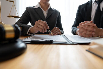 Lawyer, legal advisor, businessman brainstorming clarifying agreement details business contract Joint financial investments in office real estate projects.