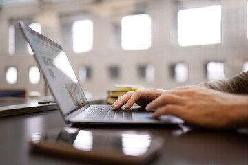Close up of copywriter hand typing on keyboard, working freelance project sitting at workplace....