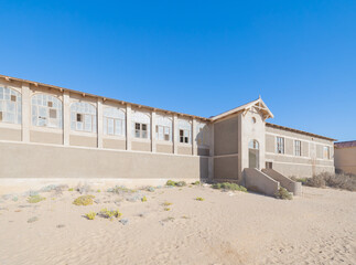 Exterior of Kolmanskop, The abandoned houses. the famous tourist attraction in Namibia, South Africa. Empty sand dune in home room . The ghost town.