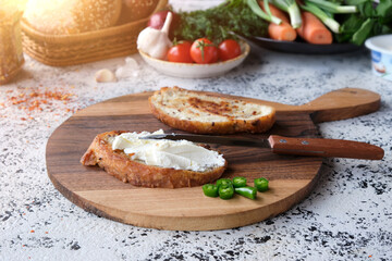 Appetizing toasted sandwiches with cream cheeses with green hot peppers