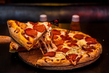 Ultimate Pepperoni Pizza: This title emphasizes the deliciousness of the classic pepperoni pizza, with an added twist of an abundance of melting cheese.