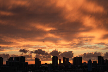 Fototapeta na wymiar Urban Sunset with Rain Clouds Overhead.