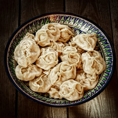 Ready-made manti in a national large plate.