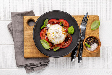 Burrata cheese, tomatoes and basil