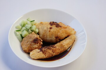 Pempek is a savoury Indonesian fishcake delicacy, made of fish and tapioca from Palembang. Pempek is served with sweet and sour sauce.