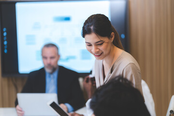 professional businessman and businesswoman meeting to work with corporate project discussion with business team together, communication of colleague teamwork group man and woman in creative office