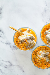 Chia pudding with passion fruit and coconut yogurt in glass. Healthy vegan recipe.