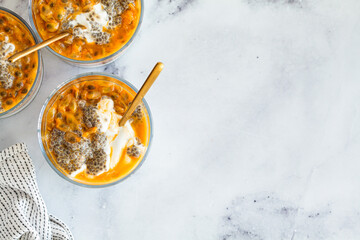 Chia pudding with passion fruit and coconut yogurt in glass. Healthy vegan recipe.
