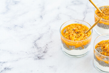 Chia pudding with passion fruit and coconut yogurt in glass. Healthy vegan recipe.