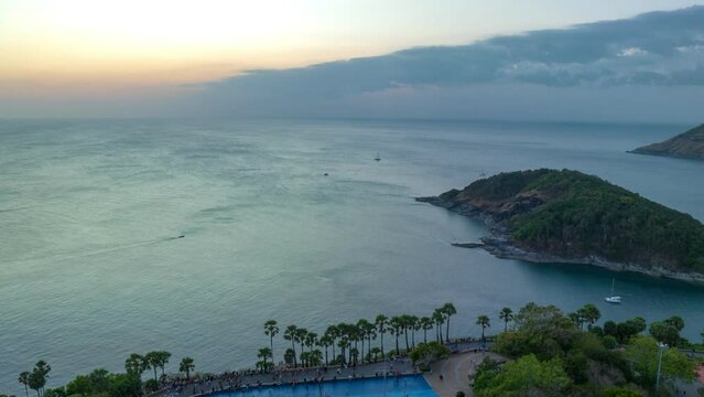 aerial hyperlapse view sunset at Laem Promthep Cape..Promthep cape viewpoint is the most popular viewpoint in Phuket island..time lapse day to night 4K video of Majestic sunset landscape.