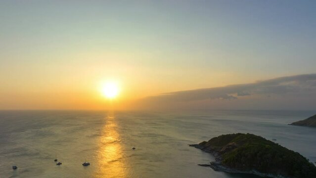 aerial hyperlapse view sunset at Laem Promthep Cape..Promthep cape viewpoint is the most popular viewpoint in Phuket island..time lapse day to night 4K video of Majestic sunset landscape.