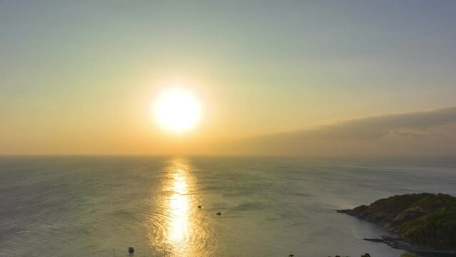 aerial hyperlapse view sunset at Laem Promthep Cape..Promthep cape viewpoint is the most popular viewpoint in Phuket island..time lapse day to night 4K video of Majestic sunset landscape.