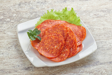 Sliced pepperoni sausage in the bowl
