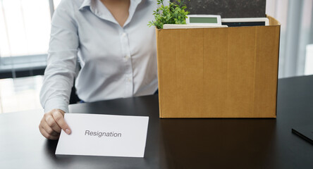 Business woman sending resignation letter to boss and Holding Stuff Resign Depress or carrying...