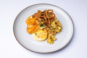Potato pancakes with grilled cheese and fried onions