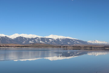 lake in the mountains,lake, mountain, water, mountains, landscape, reflection, nature, snow, sky, clouds, alps, forest, reflections, panorama, scenic, tree, travel