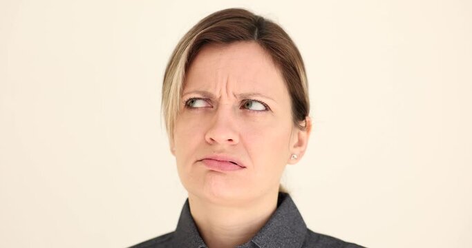 Portrait of young woman irritated and in bad mood