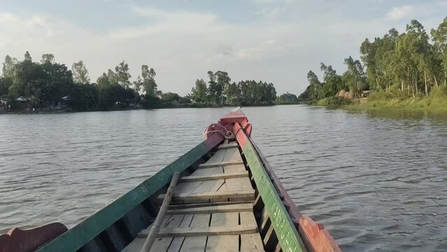 A wooden Boat  over lake with beautiful place village naturals view, 4k video 