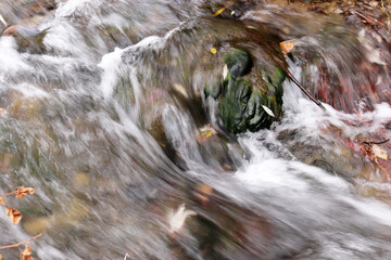 close-up view of a beautiful stream of water flowing down a narrow path