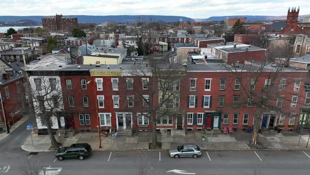 Row houses in urban American city during winter. Aerial truck shot of historic homes in crime ridden neighborhood in USA.