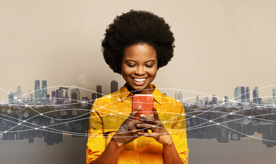 Happy african american businesswoman using smartphone, messaging or browsing social networks...