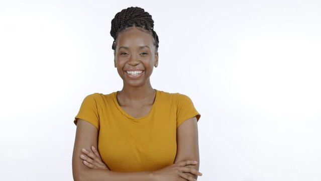 Crossed arms, smile and portrait of black woman in studio on white background for confidence, happy and excited. Leader, beauty and isolated girl with positive attitude, success mindset and wellness