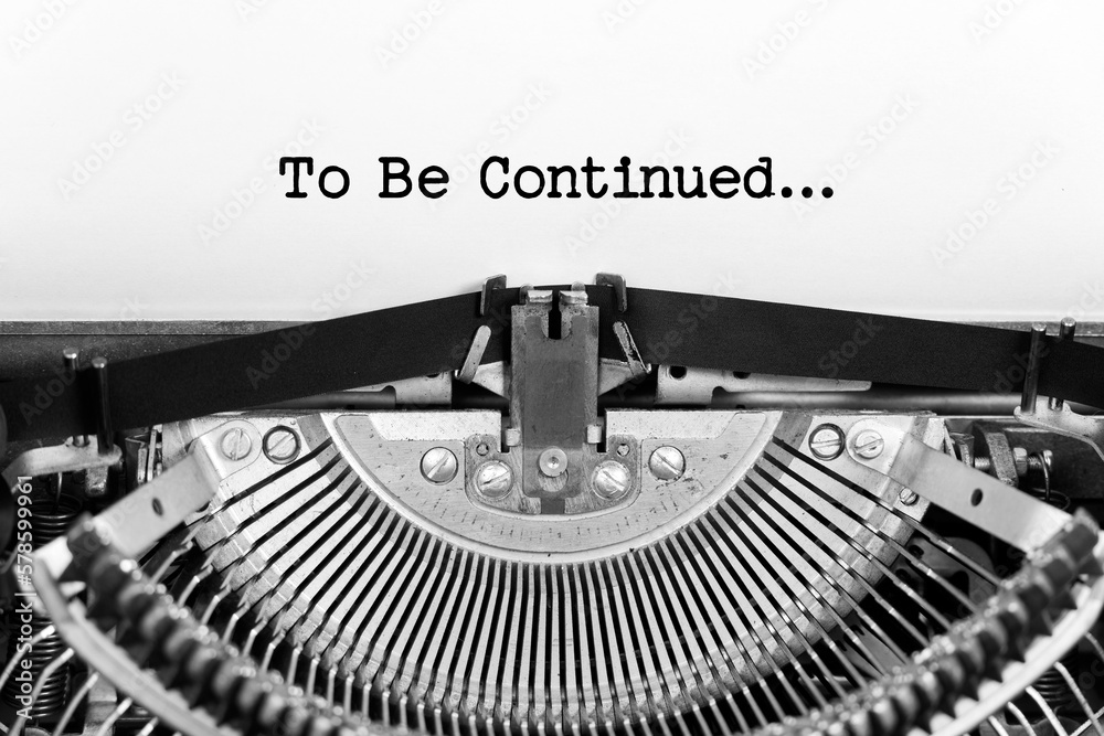 Fototapete To Be Continued phrase closeup being typing and centered on a sheet of paper on old vintage typewriter mechanical