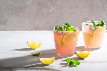 Fruity Moscow Mule cocktail on a marble background, long shadows. Variations of top cocktails. Refreshing summer drinks - 578603541