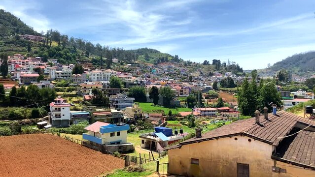 view of modern buildings Village in a hill at Nilgiri forest Ooty. Landscape of Ooty Tamil nadu India 