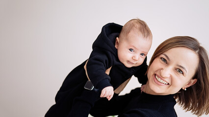  Portrait of a beautiful mother with her 3 month old baby