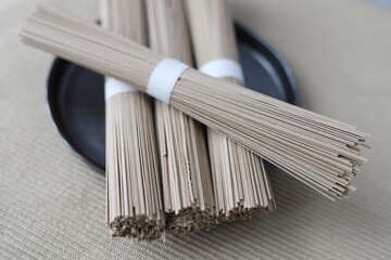 Soba noodles on a on beige background. Close up.