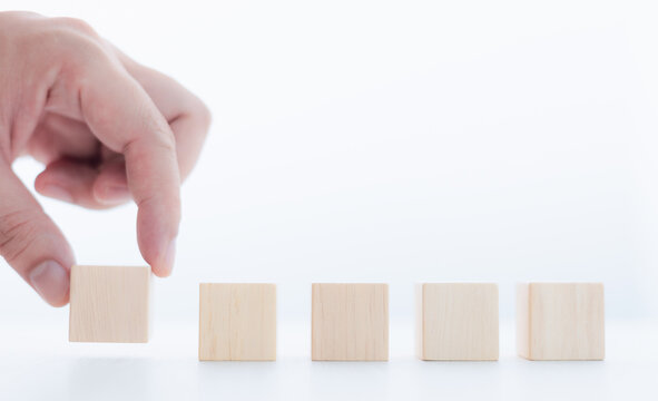 Businessman lined up wooden blocks free space to work