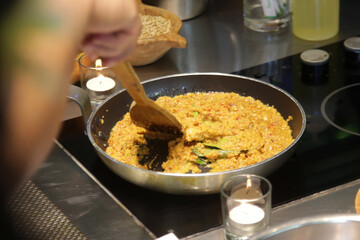 Preparation of vegan tofu scramble in cooking pan	