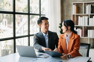 Portrait of success business people working together in office. Couple teamwork startup concept