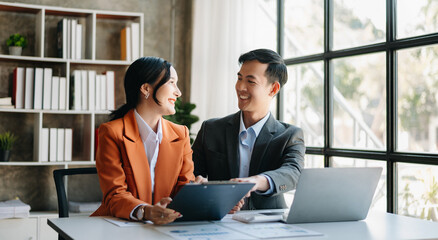 Portrait of success business people working together in office. Couple teamwork startup concept