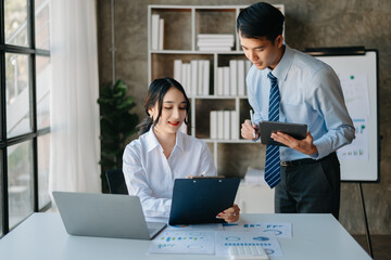 Portrait of success business people working together in home office. Couple teamwork startup concept

