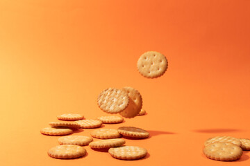 Cookies on orange background. Artistic background for pastry or sweet snacks